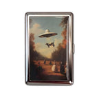 Bovine Abduction tin cardholder wallet with UFO lifting a cow over a vintage landscape